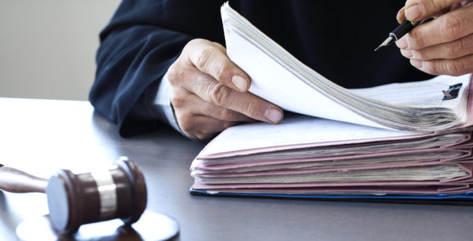 Judge with gavel on table
